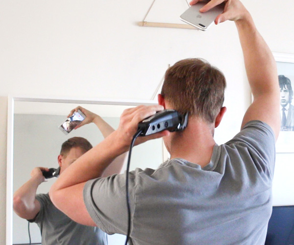 clipper hair in back with phone as mirror