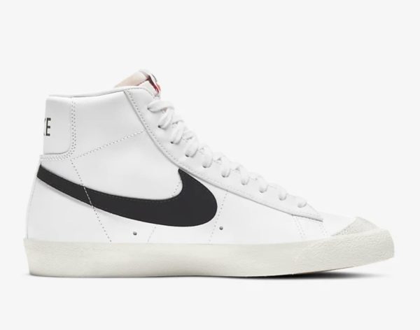 nike mid top white sneaker with black nike brand logo