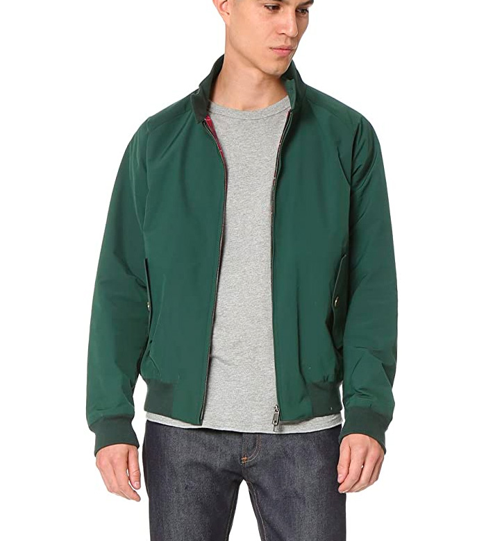 A man wearing a green harrington jacket