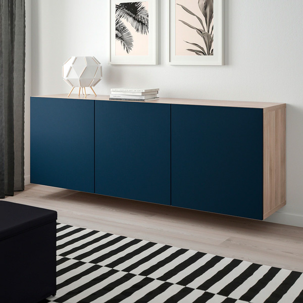 A triple door side table in a room