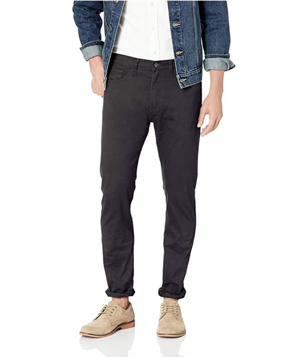 A person standing posing for the camera wearing dockers pants