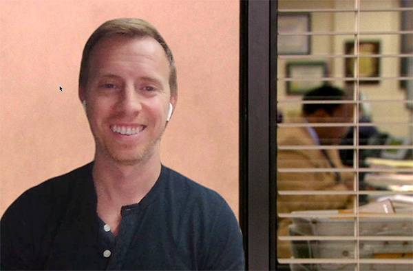A man standing in front of a window