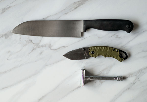 a chefs knife, folding knife, and razor