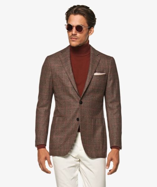 A man wearing a brown suit jacket