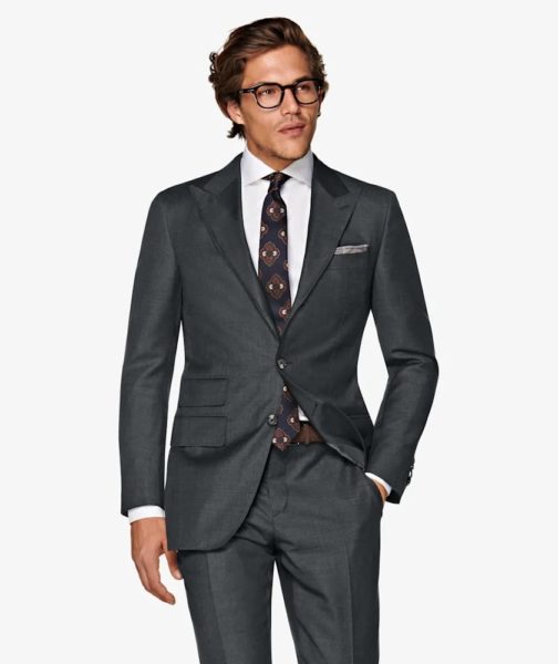 Image of man wearing a dark grey 3 piece suit
