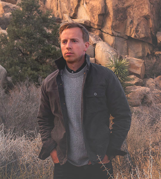 man wearing brown flint and tinder jacket