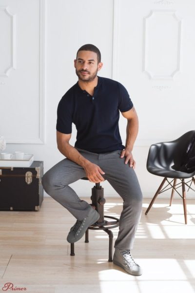 man wearing a short sleeve shirt and grey pants for primer magazine