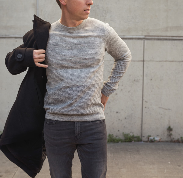 man wearing an ombre cotton style sweater