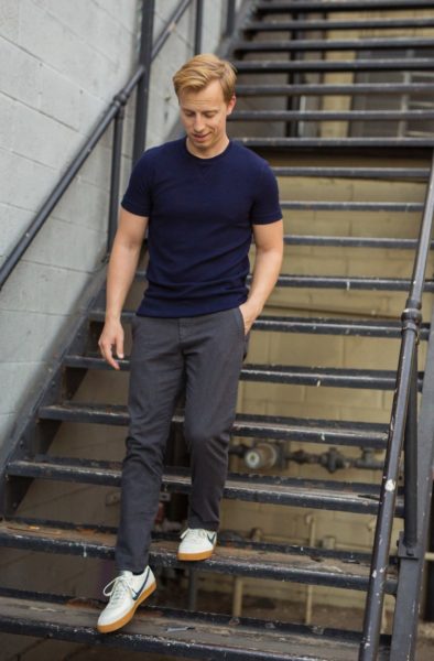 man wearing a short sleeved sweater and pants for primer magazine