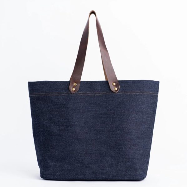 denim tote bag with brown leather handles