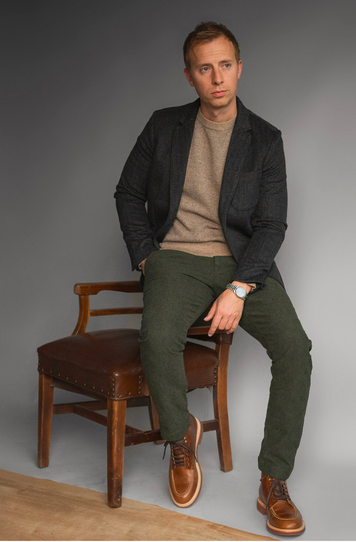 man wearing business casual outfit with rugged style and moc toe boots