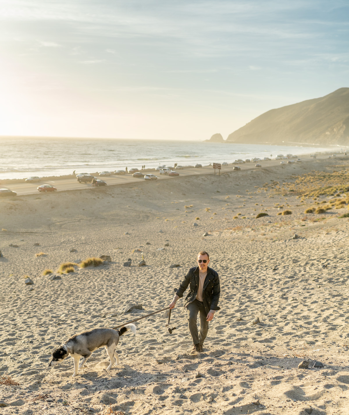 men-spring-fashion-outfit-casual casual spring fashion men - man wearing casual outfit walking on beach