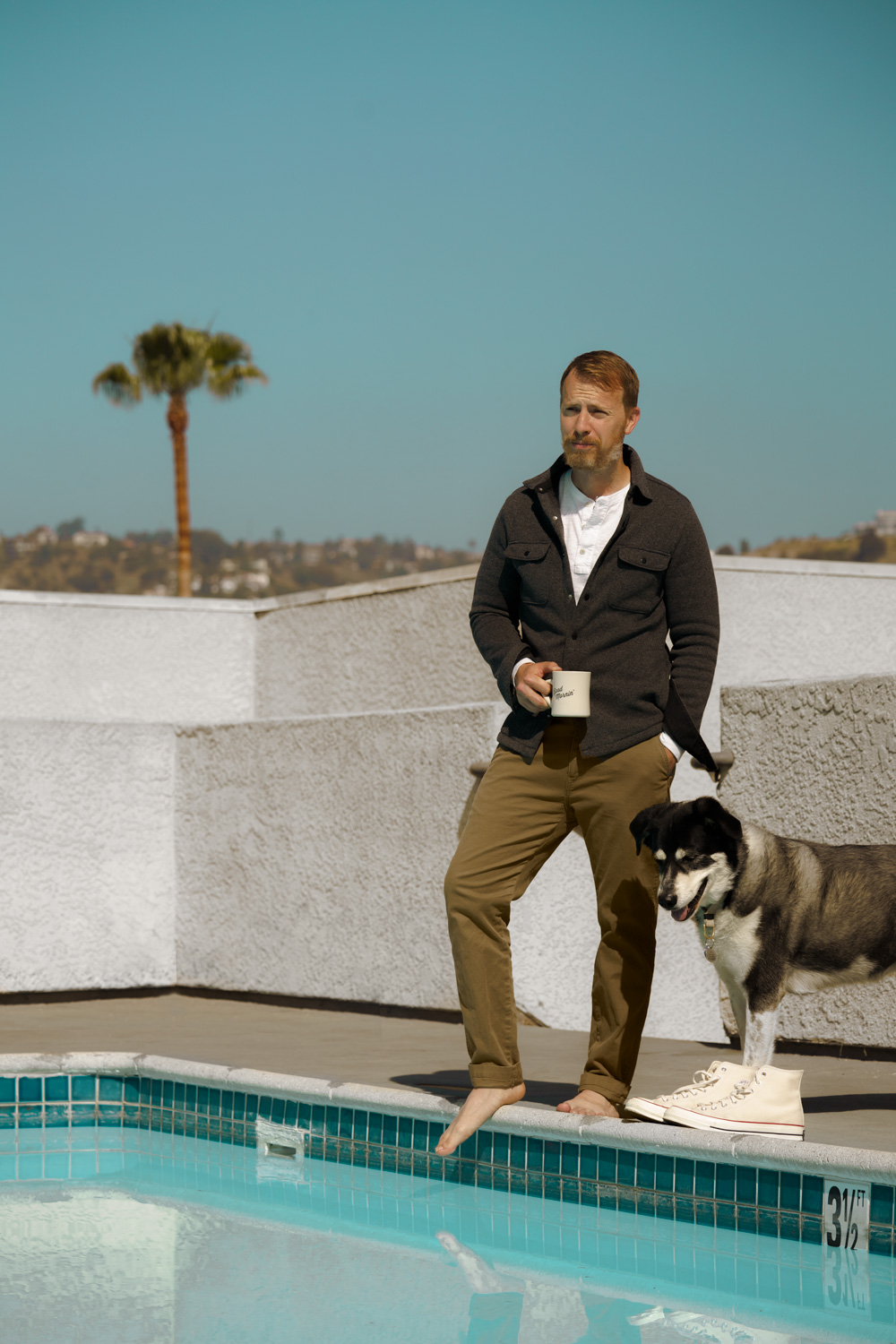 image of a man wearing chino pant and black cardigan