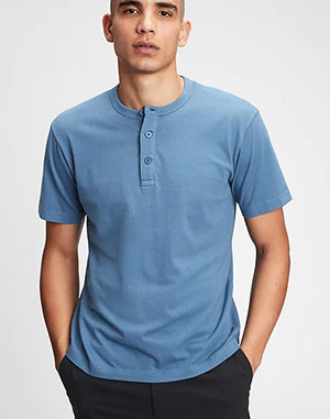 man wearing a blue short sleeve henley shirt from gap