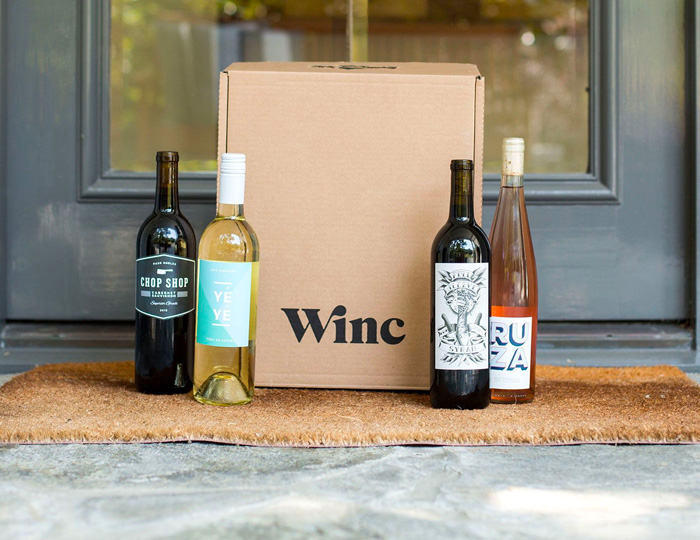 winc wine subscription box with 4 wine bottles
