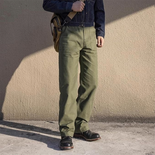 a man wearing fatigue style pants with boots