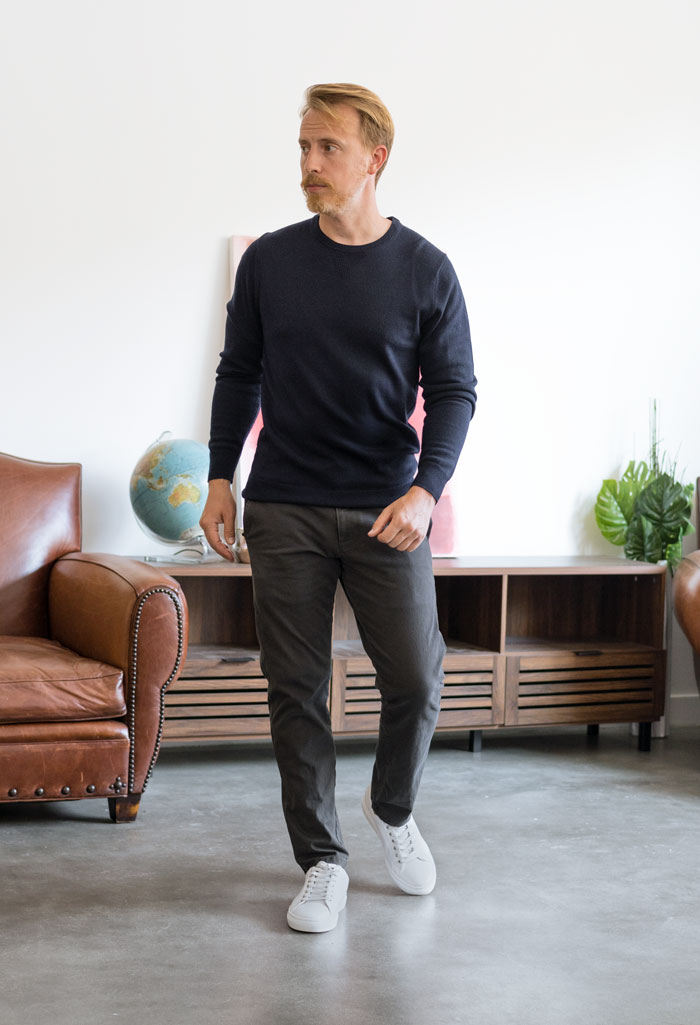 navy sweater with grey dockers chinos and white sneakers