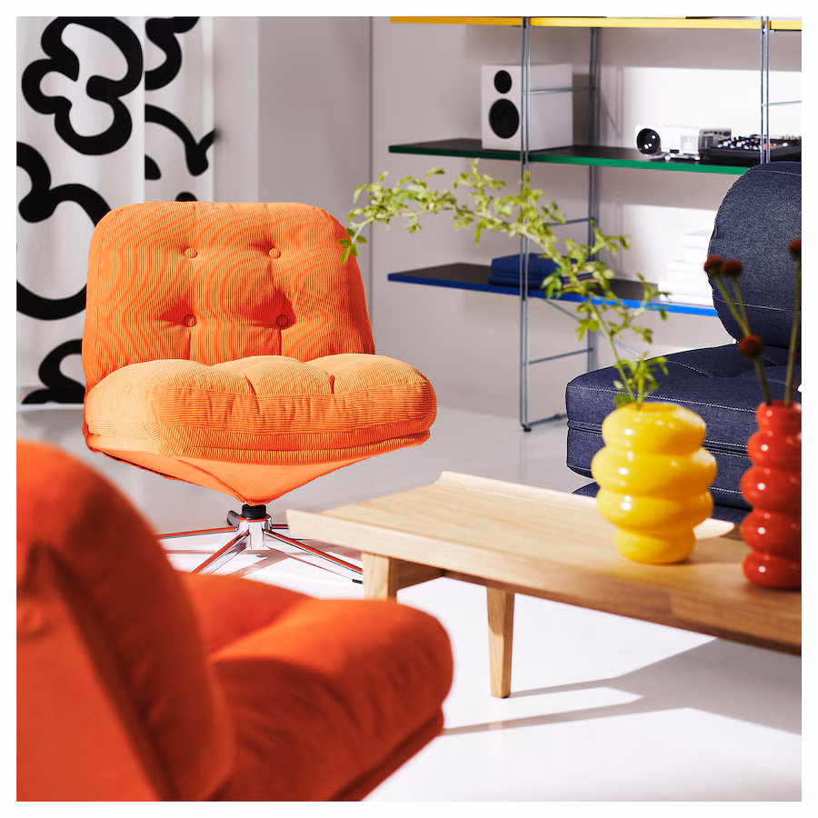 upholsterd orange siwvel chair in a white room
