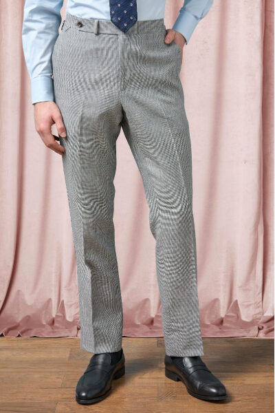 man wearing puppy tooth pattern trousers with dress shoes