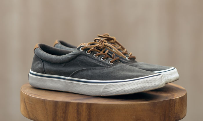 a pair of sperry lace up sneakers