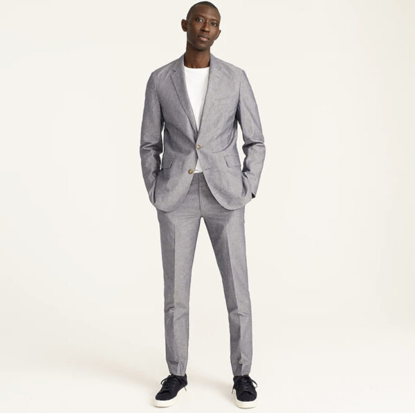 man wearing a grey suit jacket and grey suit pants