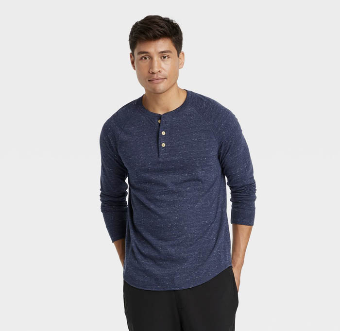 man wearing a dark blue long sleeve henley shirt