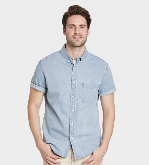 man wearing a denim short sleeve button down shirt