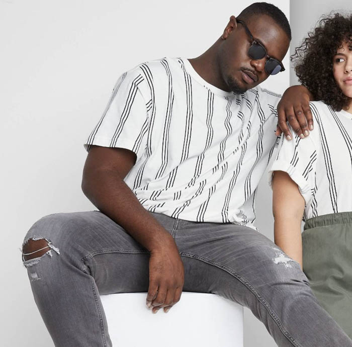 man wearing a striped white crewneck short sleeve shirt