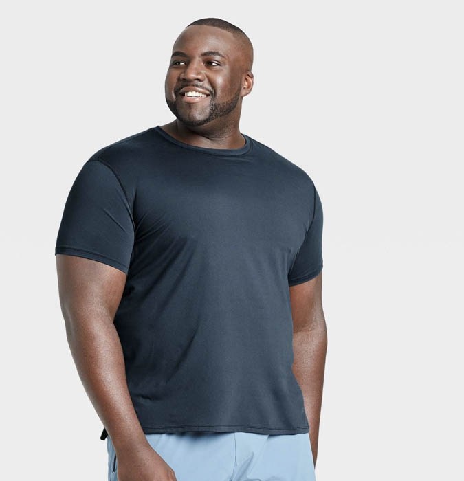 man wearing a navy blue short sleeve performance shirt