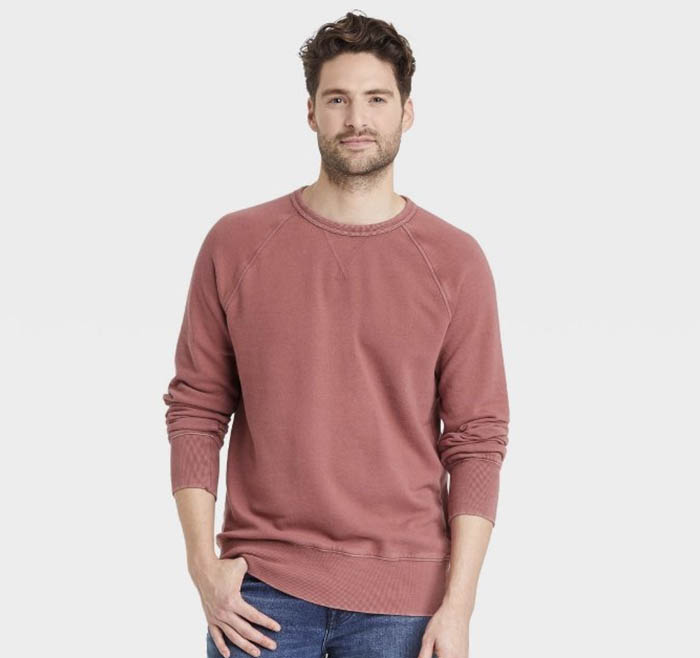 man wearing a red crewneck sweatshirt