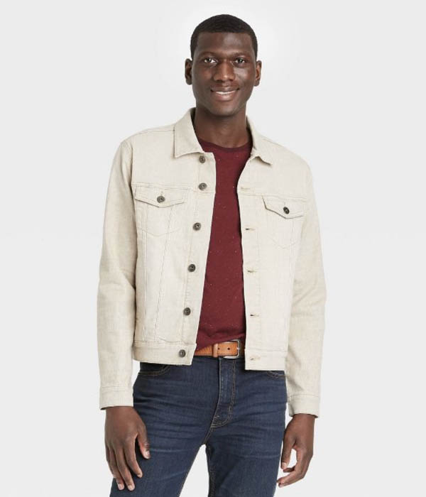 man wearing a khaki colored denim trucker jacket