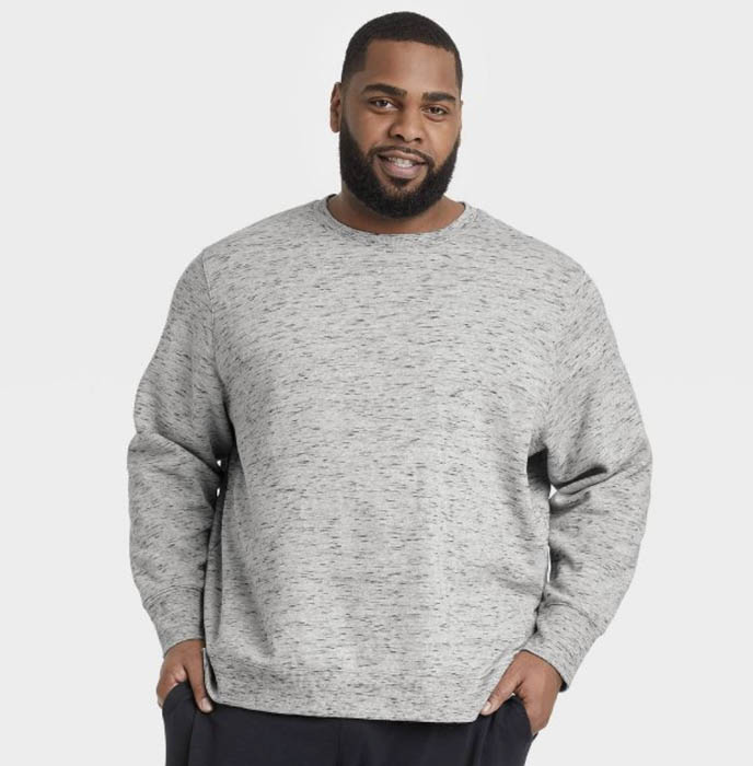 man wearing a grey fleece crewneck sweatshirt
