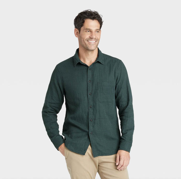 man wearing a dark green long sleeve button down shirt