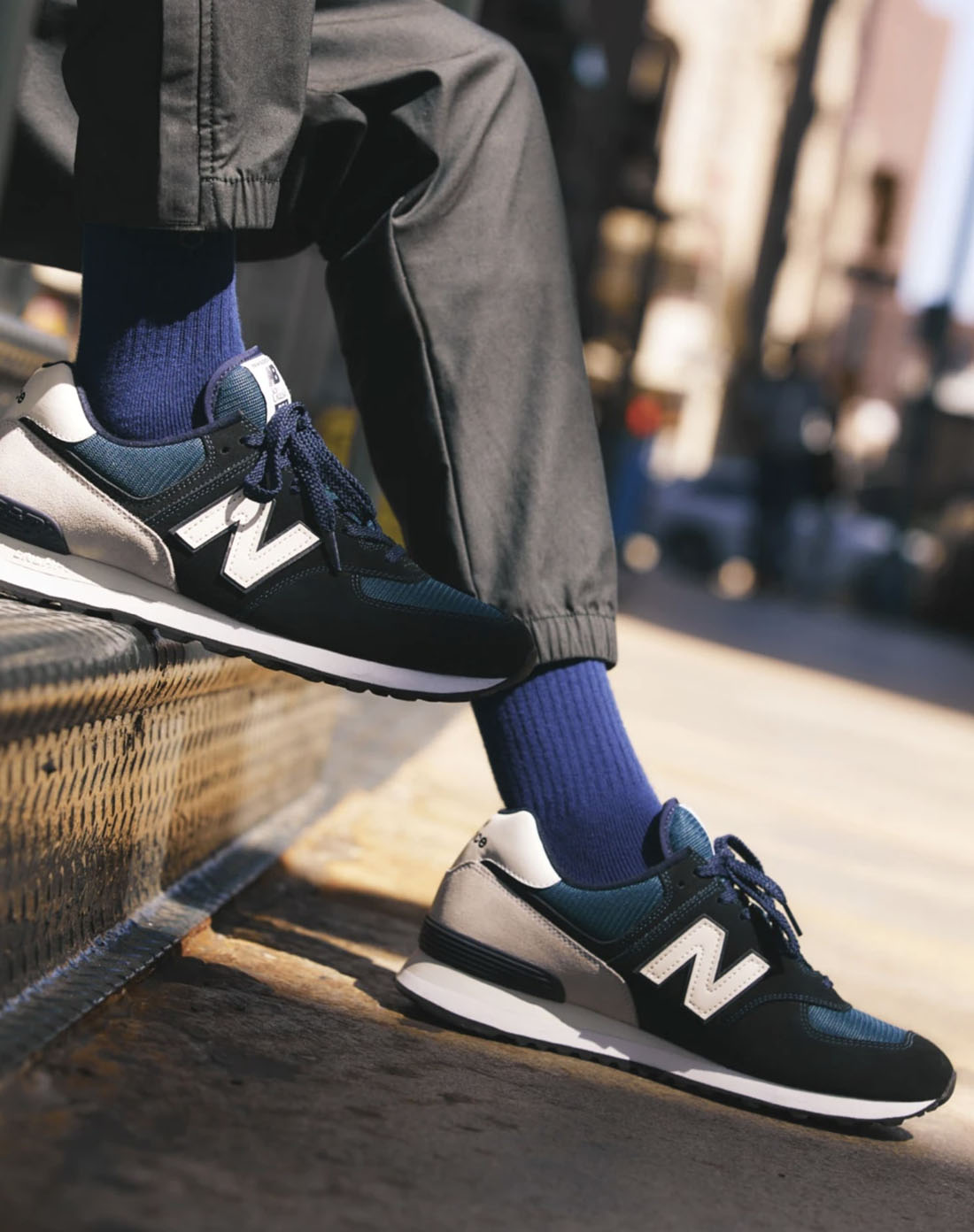 jcrew14 close up image of black and white nike brand shoes and blue socks