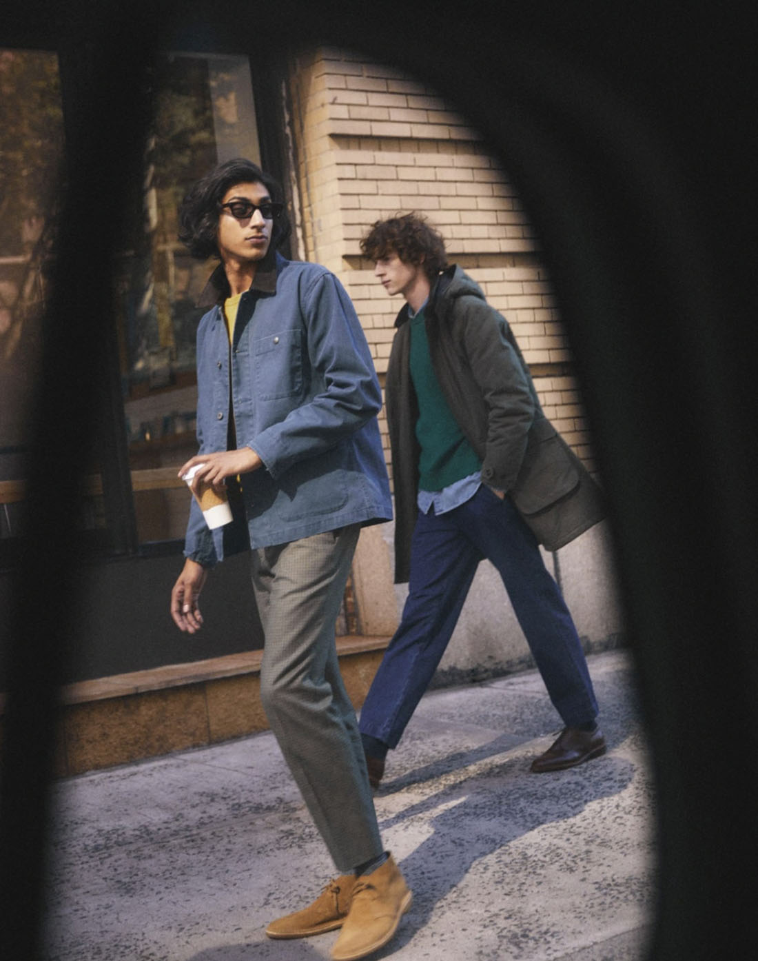 jcrew5 man wearing a blue coat jacket walking on sidewalk