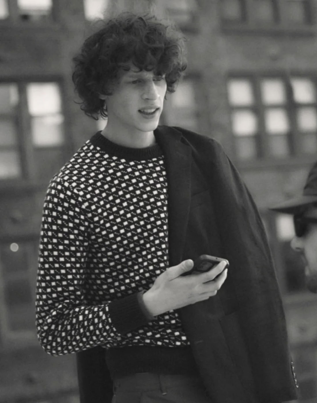 jcrew9 black and white image of a man wearing a dot printed sweater