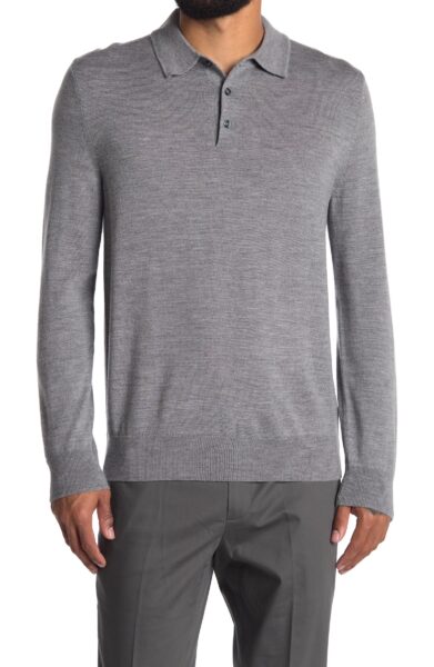 close up image of a man wearing a long sleeve grey polo shirt