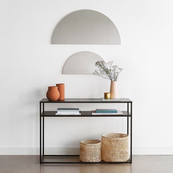 image of half moon shape mirror and a decorative table