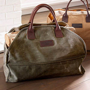 image of a waxed canvas log carrier bag
