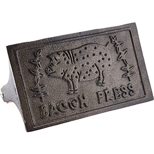 image of an iron bacon press and steak weight kitchen item