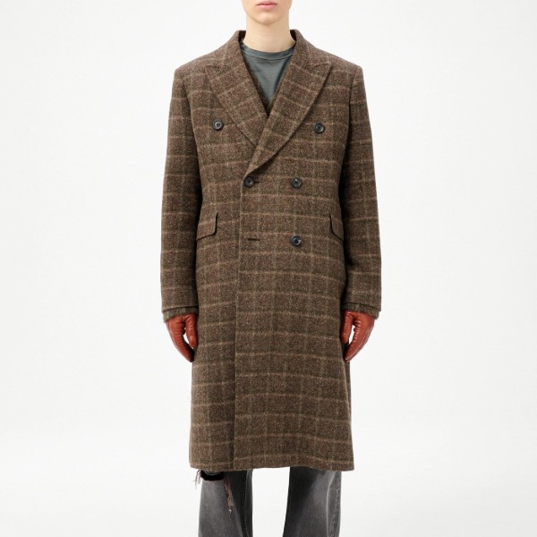 person wearing a checkered pattern tweed coat with loose fit pants