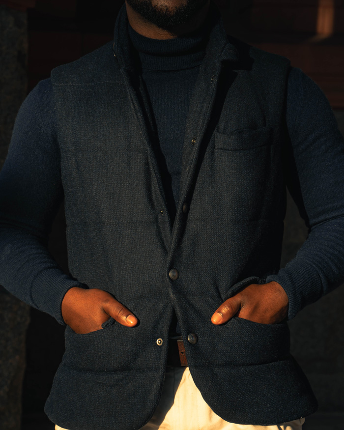 man wearing a turtleneck with vest