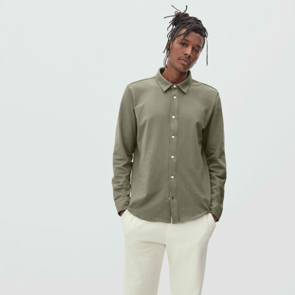 image of a man wearing a green button down long sleeve shirt