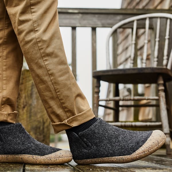 image of a person wearing a grey slipper boot