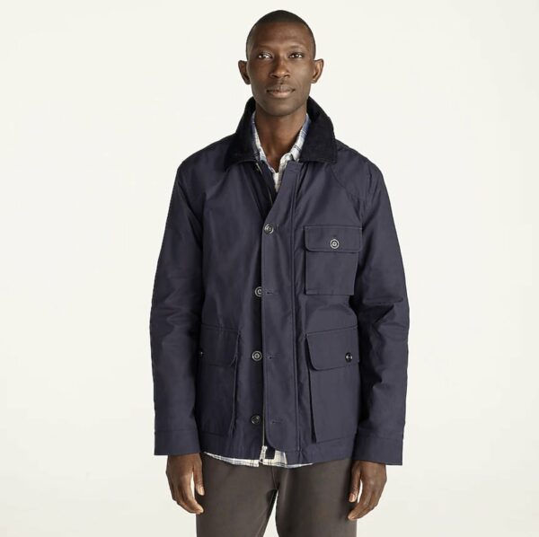 image of a man wearing a navy blue utility jacket