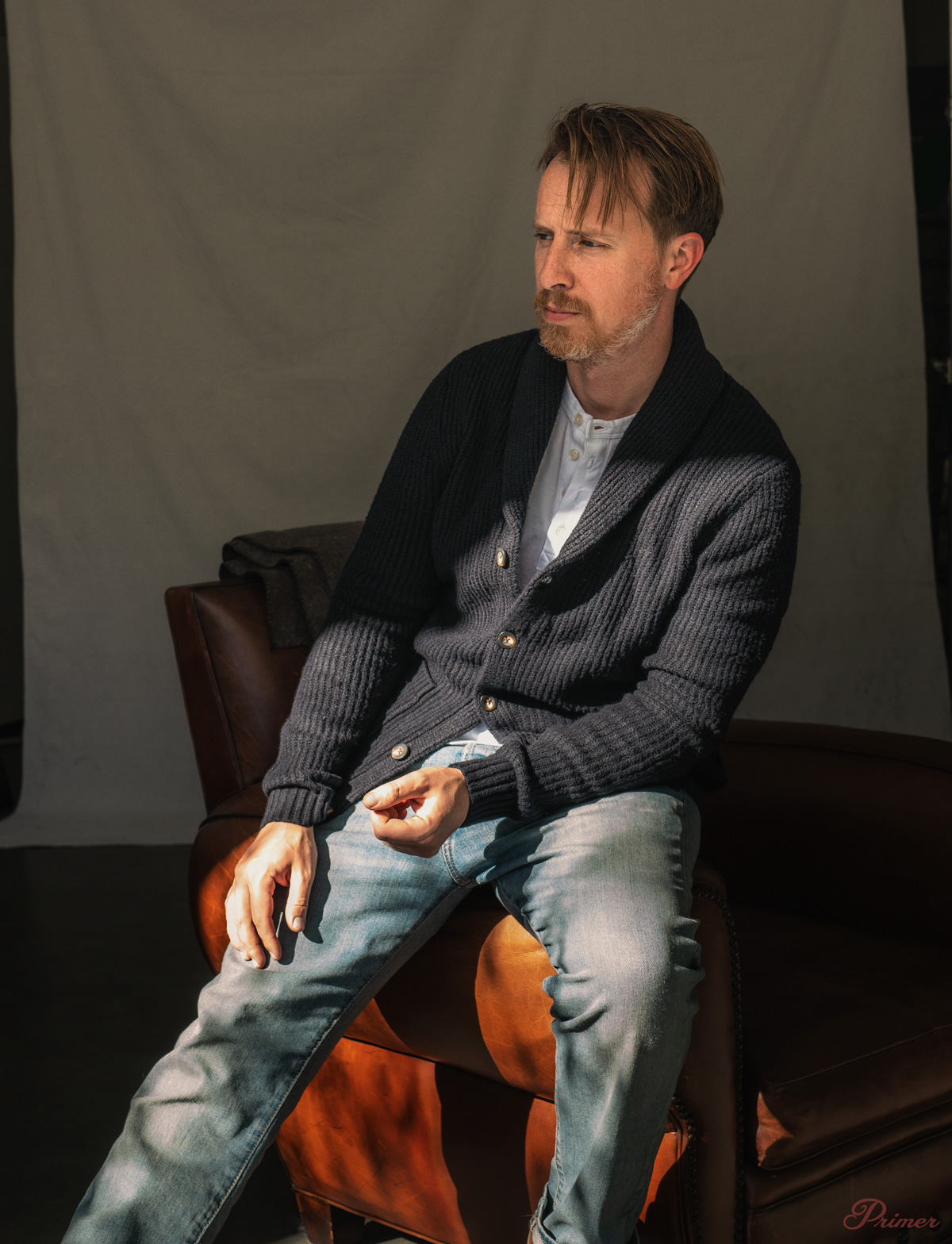 man wearing a black shawl collar cardigan