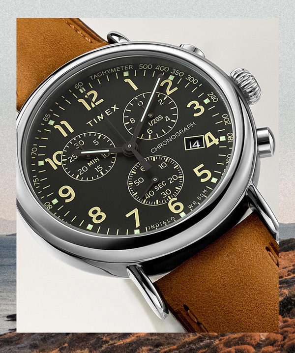 image of a watch with brown strap and black dial face