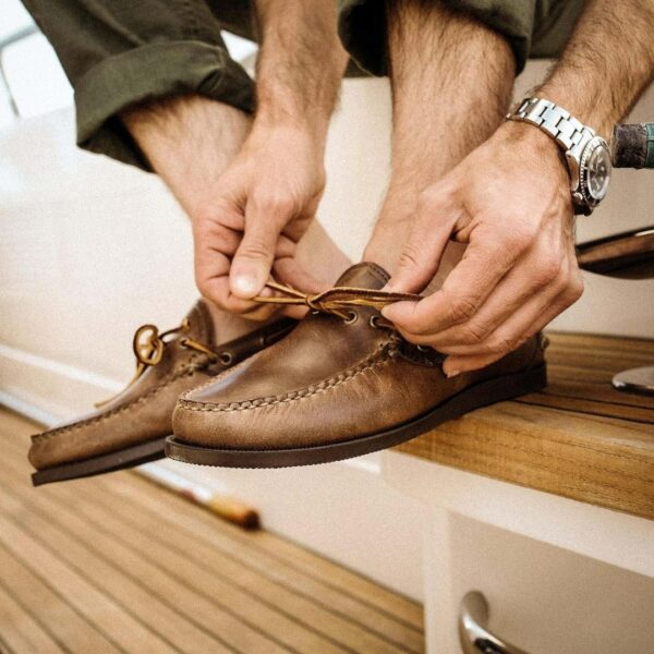 image of a close up of a person tying shoelaces