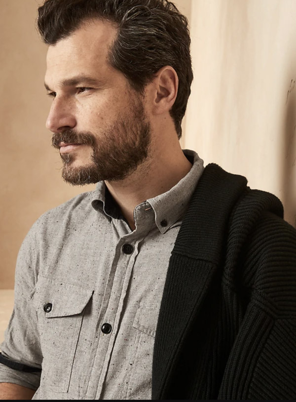 image of a man wearing a grey long sleeve button up shirt