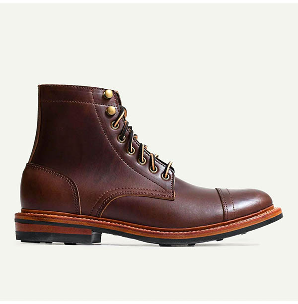 image of a brown cap toe high top boot